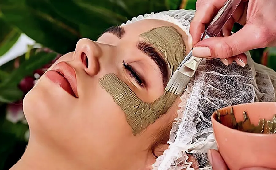 Herbal facial being applied